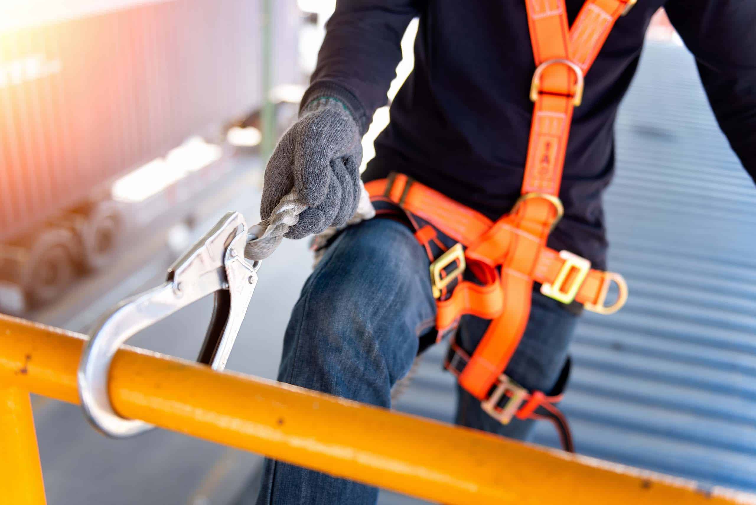 Construction worker use safety harness and safety line working o